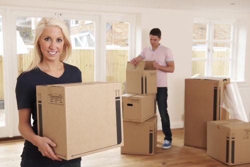 Removal van and moving team preparing a house move in Frognal