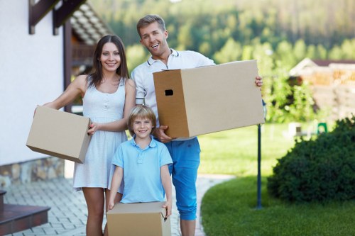Packed boxes and furniture loaded into a van for a Frognal move