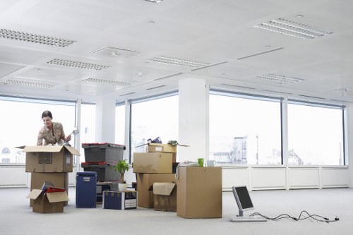 Office furniture, boxes, and equipment prepared for a commercial move
