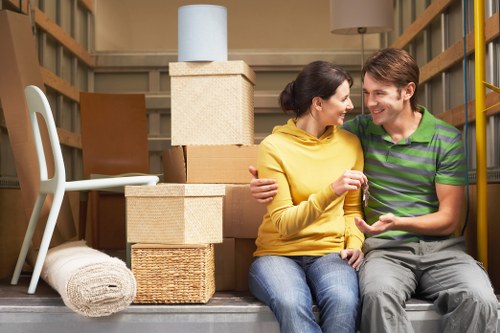 Packed boxes and furniture prepared for a Frognal home relocation