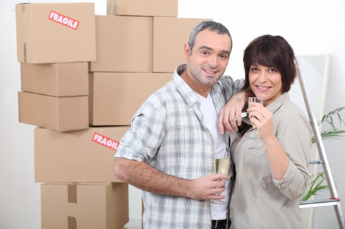 Professional house movers unloading boxes at a Frognal property